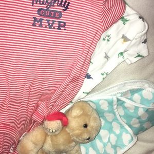 Two onesies,a baby bib and apron a with teddybear